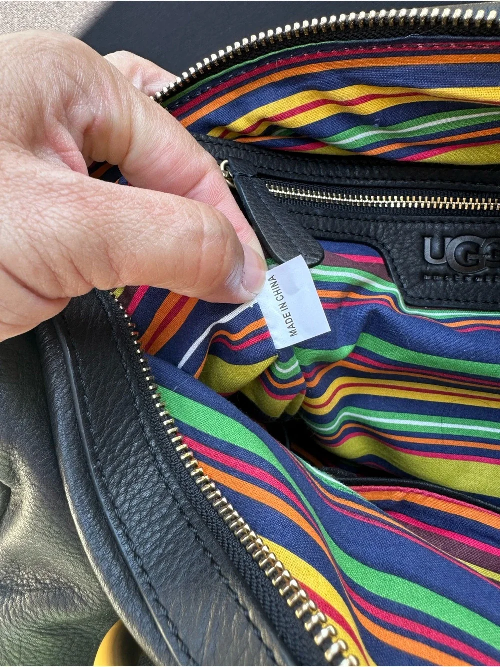 UGG Black Leather Satchel with Gold Ring Handles and Multicolor Stitching
